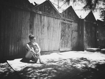 Woman sitting outside the tiny huts at the beach in viertri sul mare. 