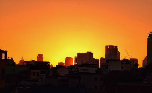 Cityscape against sky during sunset