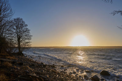 Scenic view of sea against sky during sunset