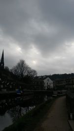 Buildings against cloudy sky