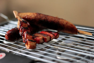 Close-up of meat on barbecue grill