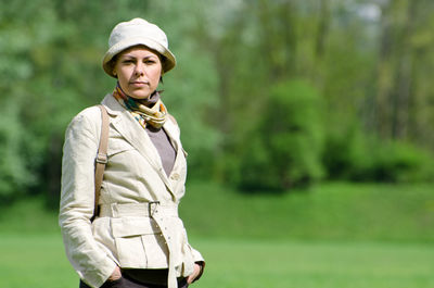 Portrait of mid adult woman standing at park