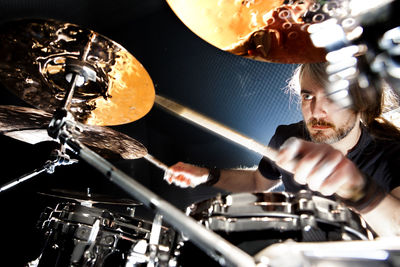 Cropped hand of man welding equipment