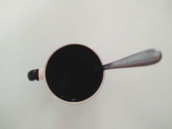 Close-up of cup over white background