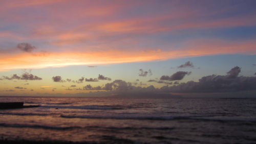 Scenic view of sea against dramatic sky