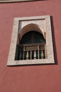 Low angle view of window on building wall