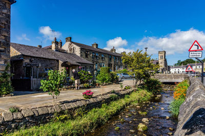 Plants growing outside building against sky