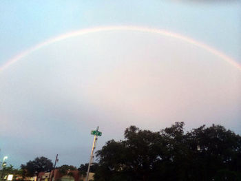 Low angle view of rainbow against sky