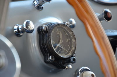 Close-up of speedometer on dashboard in vintage car