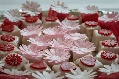 Colorful petit fours with flower decoration