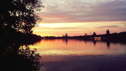 Scenic view of lake against sky during sunset