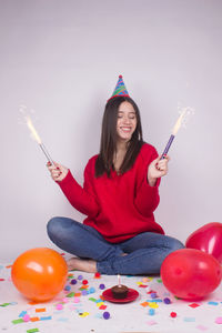 Portrait of woman with balloons