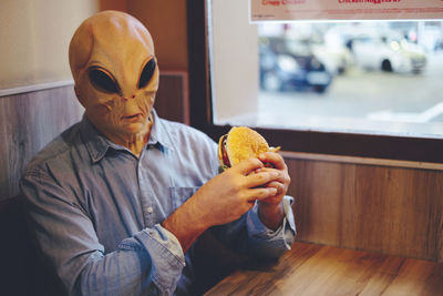 Midsection of man holding food