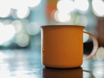 Close-up of coffee cup on table