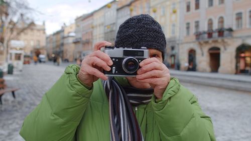 Portrait of man photographing