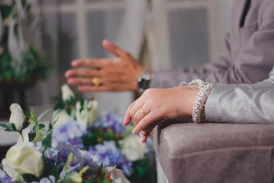 Close-up of woman hand holding flower bouquet