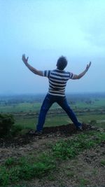 Woman jumping on field