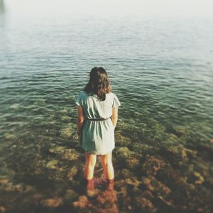 Woman standing in water