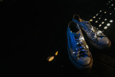 Close-up of shoes on black background