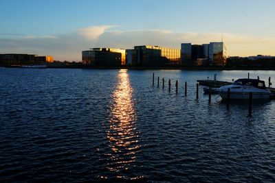 Buildings in city at sunset