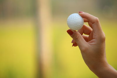 Close-up of hand holding ball