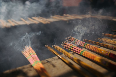 Close-up of smoke emitting from burning incense
