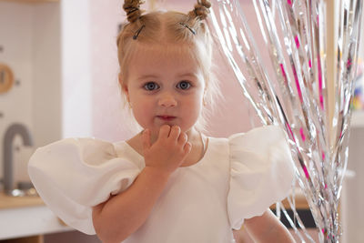 Close-up of cute girl with daughter at home