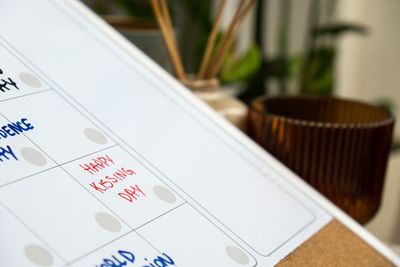 Happy kissing day on calendar to remind important event appointment monthly planner. magnetic board