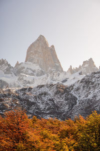 Scenic view of snowcapped mountains against clear sky