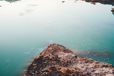 High angle view of rocks in sea