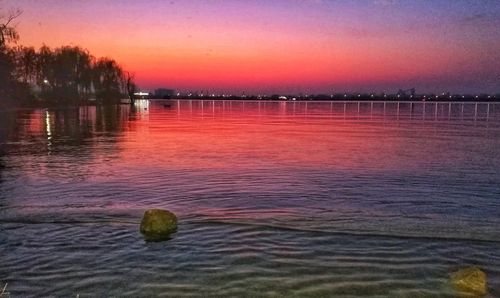 Scenic view of sea against sky at sunset