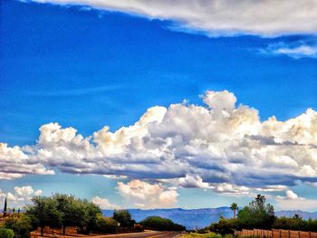 Scenic view of mountains against cloudy sky