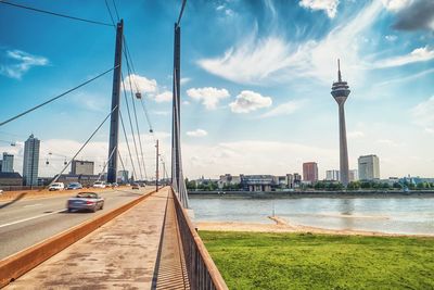 View of suspension bridge against cloudy sky