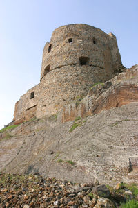 Low angle view of fort against sky