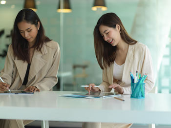 Young businesswomen brainstorming at office