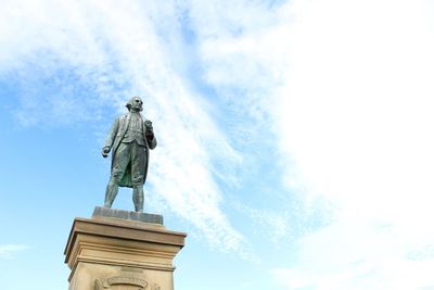 Low angle view of statue against sky