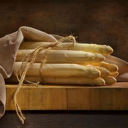 Close-up of white asparagus on table