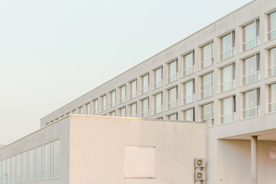 Low angle view of exterior of building against clear sky