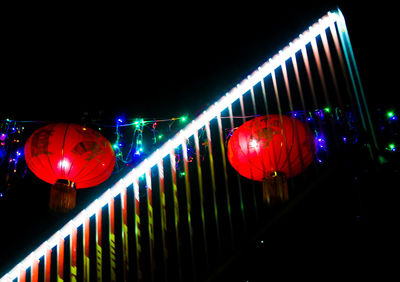 Illuminated red lights at night