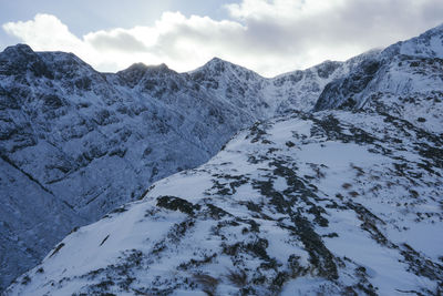 Scenic view of mountains against sky during winter