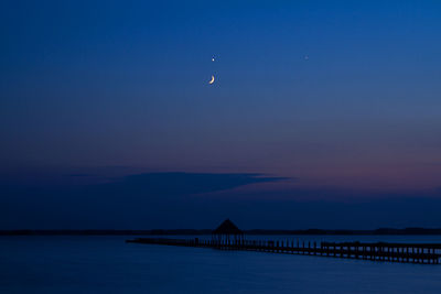 Scenic view of sea against sky at dusk