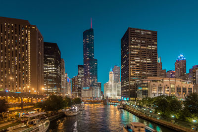 Illuminated buildings in city at night