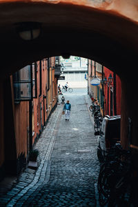 Empty alley amidst buildings in city