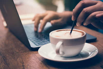 Close-up of coffee cup on table