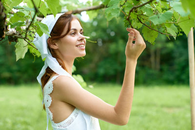 Side view of young woman looking away