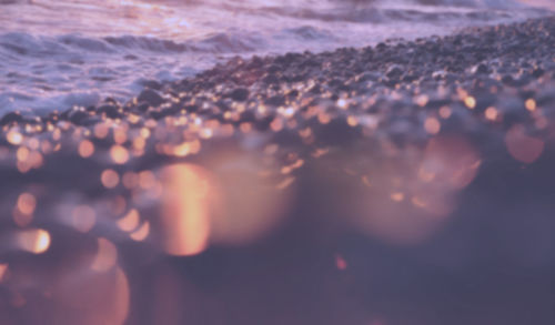 Close-up of sea at sunset