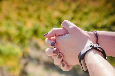 Close-up of woman hand holding outdoors
