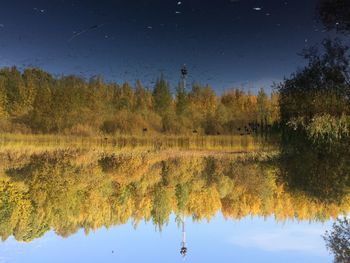 Scenic view of lake against sky during autumn