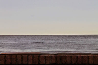 Scenic view of sea against clear sky during sunset