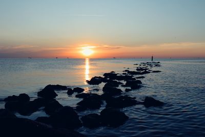 Scenic view of sea against sky during sunset